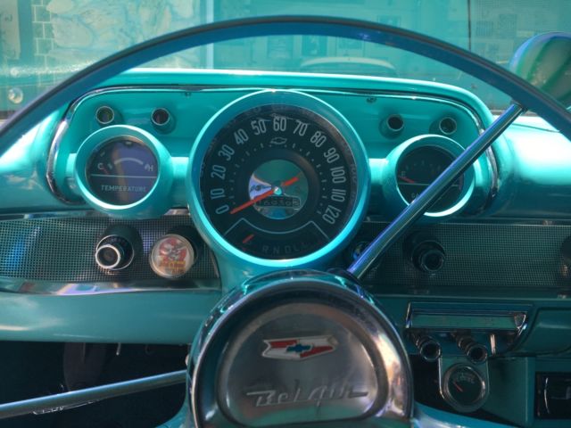 turquoise and India Ivory 1957 Chevrolet Bel Air/150/210 sedan with turquoise interior