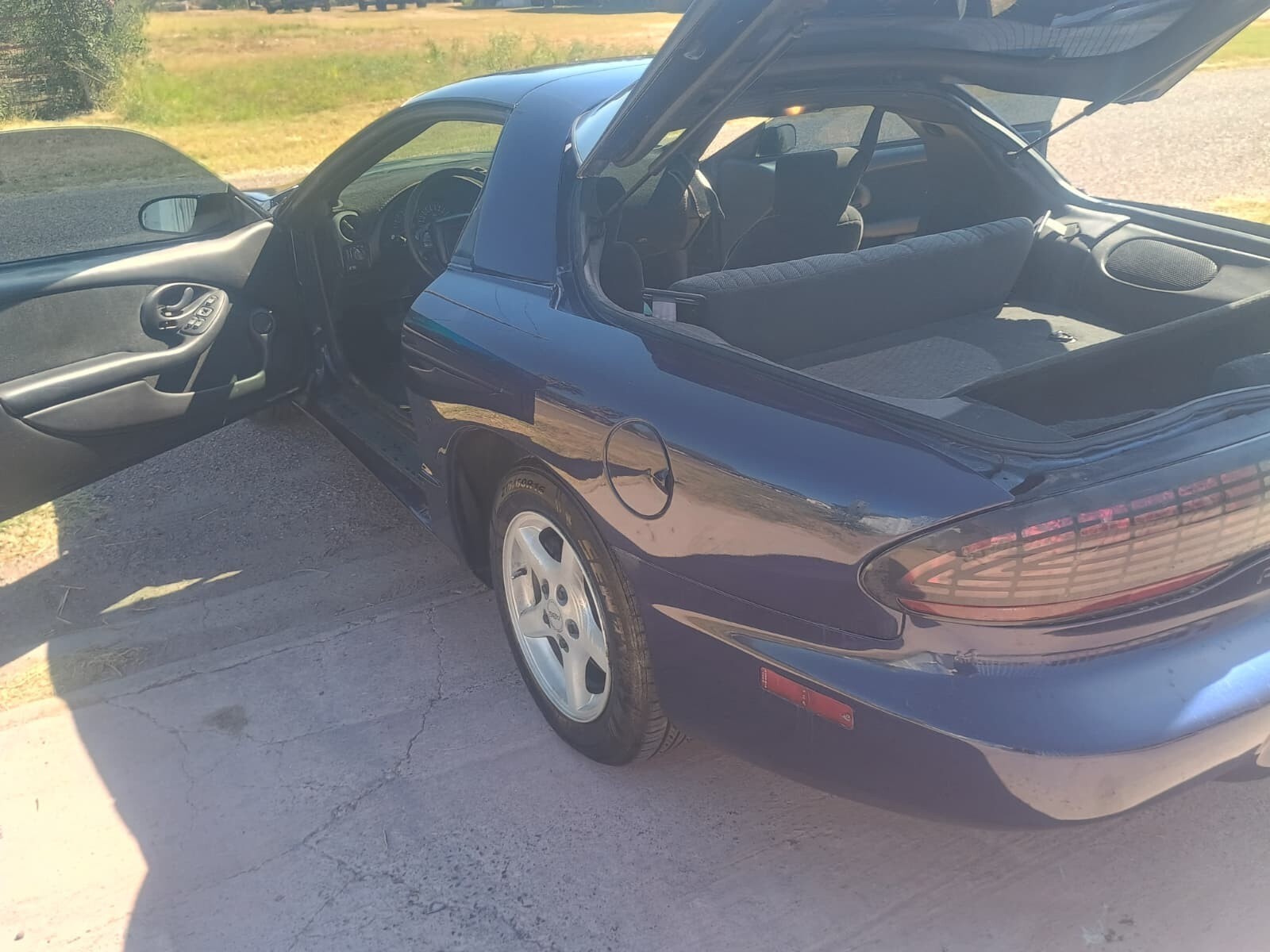 Blue 1924 Pontiac Trans Am with Gray interior