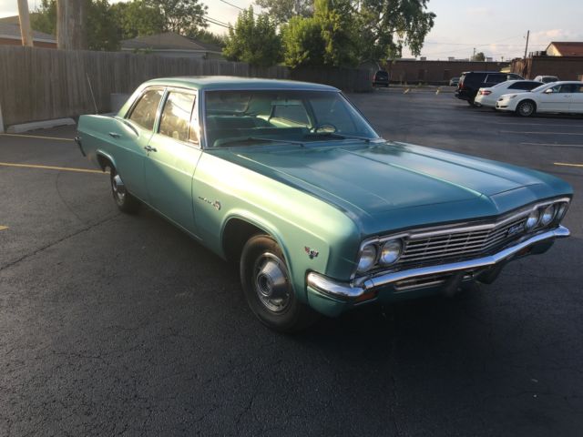 turquoise 1966 Chevrolet Impala Sedan with turquoise interior