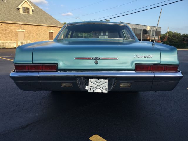 turquoise 1966 Chevrolet Impala Sedan with turquoise interior