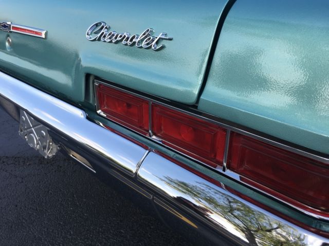 turquoise 1966 Chevrolet Impala Sedan with turquoise interior