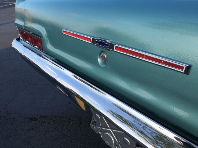turquoise 1966 Chevrolet Impala Sedan with turquoise interior