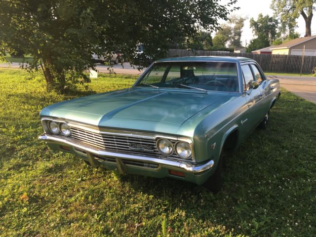 turquoise 1966 Chevrolet Impala Sedan with turquoise interior