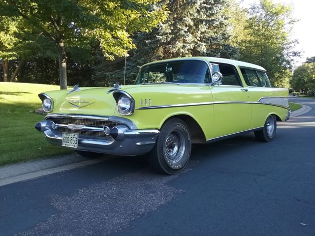 Yellow 1957 Chevrolet Nomad Wagon with Black interior