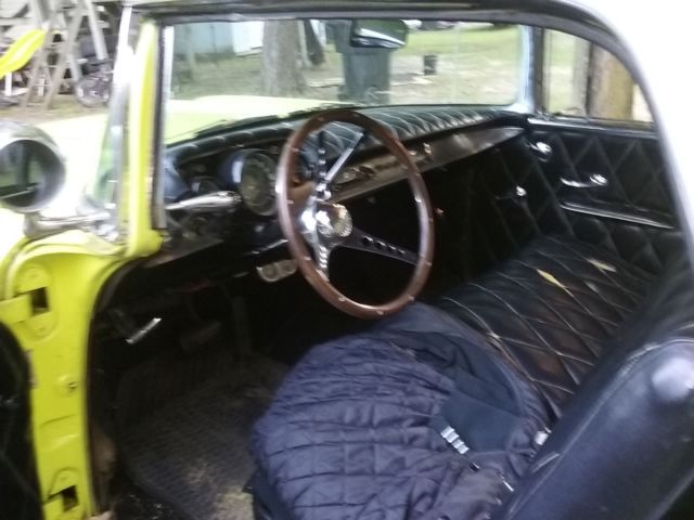 Yellow 1957 Chevrolet Nomad Wagon with Black interior