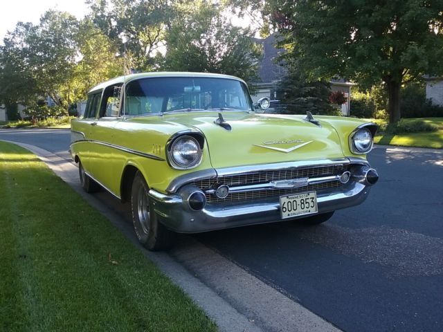 Yellow 1957 Chevrolet Nomad Wagon with Black interior