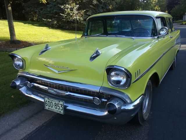 Yellow 1957 Chevrolet Nomad Wagon with Black interior