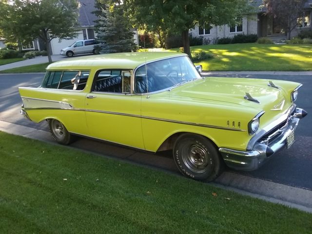 Yellow 1957 Chevrolet Nomad Wagon with Black interior