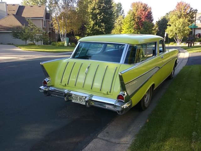 Yellow 1957 Chevrolet Nomad Wagon with Black interior