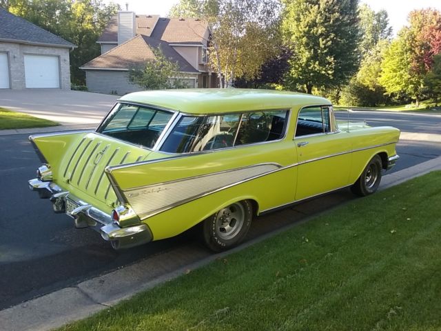Yellow 1957 Chevrolet Nomad Wagon with Black interior