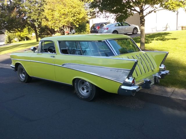 Yellow 1957 Chevrolet Nomad Wagon with Black interior