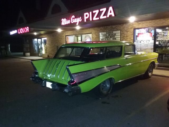 Yellow 1957 Chevrolet Nomad Wagon with Black interior