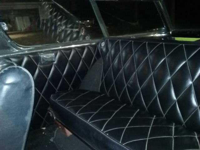 Yellow 1957 Chevrolet Nomad Wagon with Black interior
