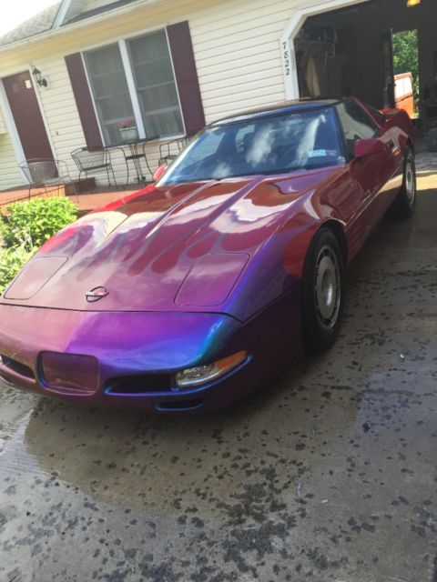 Tri red with harlequin graphics 1987 Chevrolet Corvette Coupe with Black interior