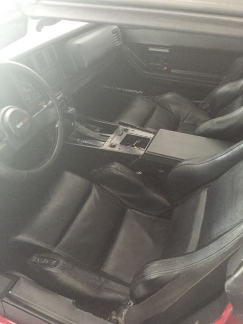 Tri red with harlequin graphics 1987 Chevrolet Corvette Coupe with Black interior