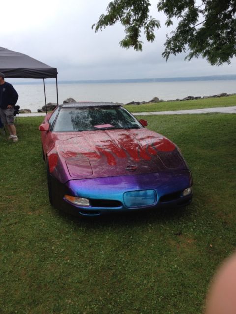 Tri red with harlequin graphics 1987 Chevrolet Corvette Coupe with Black interior