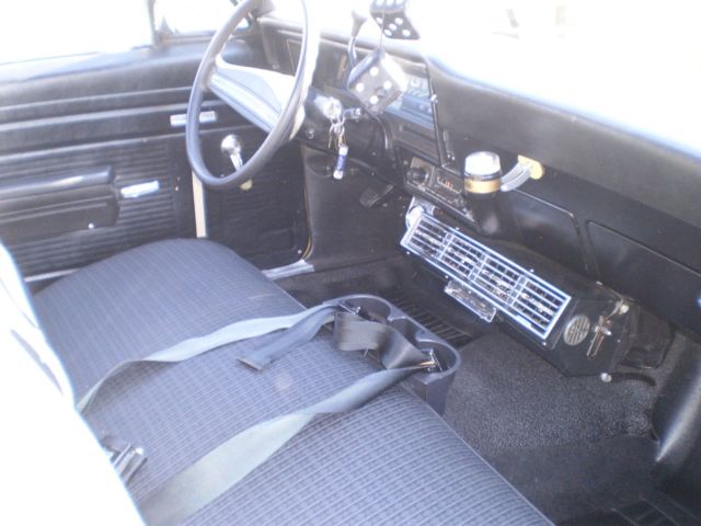 Gold 1971 Chevrolet Nova Coupe with Black interior