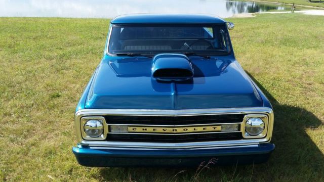 dark blue green terquois 1970 Chevrolet C-10 truck with grey and terquois interior