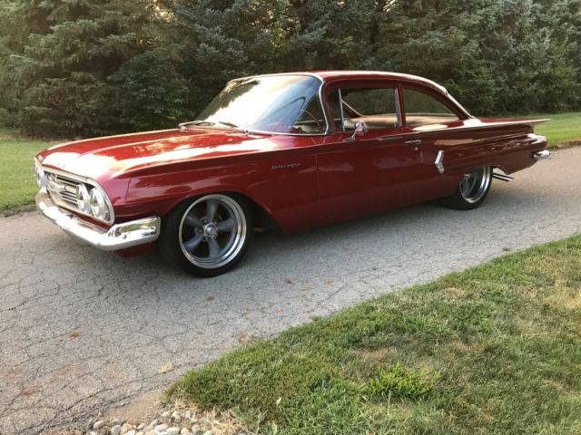 Red 1960 Chevrolet Impala Sedan with Blue interior