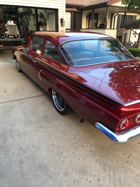 Red 1960 Chevrolet Impala Sedan with Blue interior