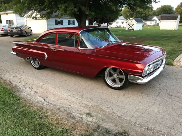 Red 1960 Chevrolet Impala Sedan with Blue interior