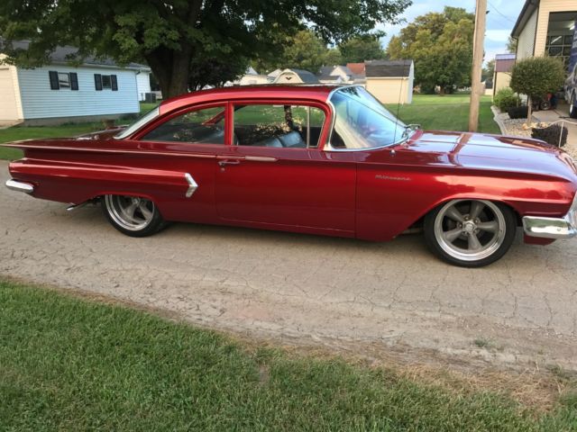 Red 1960 Chevrolet Impala Sedan with Blue interior