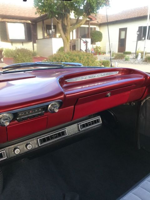 Red 1960 Chevrolet Impala Sedan with Blue interior