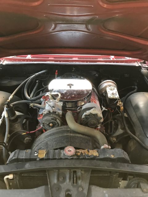 Red 1960 Chevrolet Impala Sedan with Blue interior