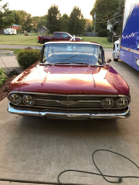 Red 1960 Chevrolet Impala Sedan with Blue interior