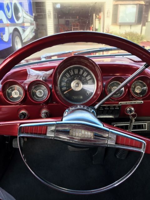 Red 1960 Chevrolet Impala Sedan with Blue interior