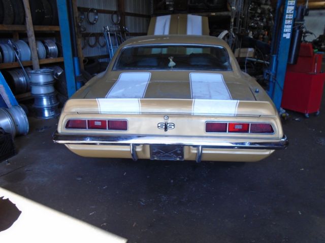 Olympic gold 1969 Chevrolet Camaro Coupe with Green interior