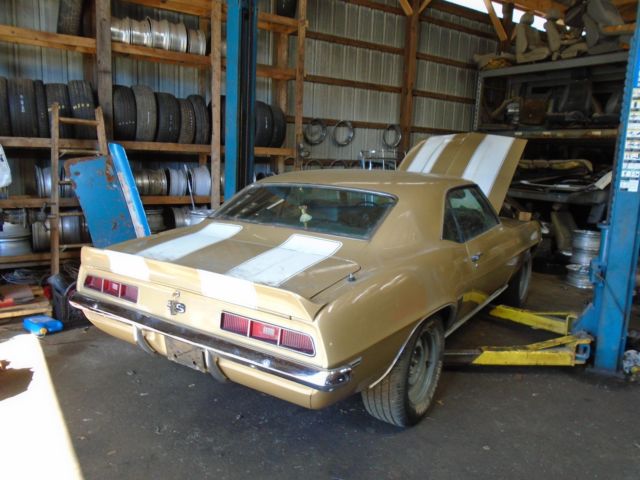 Olympic gold 1969 Chevrolet Camaro Coupe with Green interior