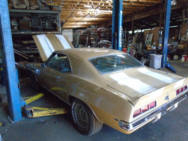 Olympic gold 1969 Chevrolet Camaro Coupe with Green interior