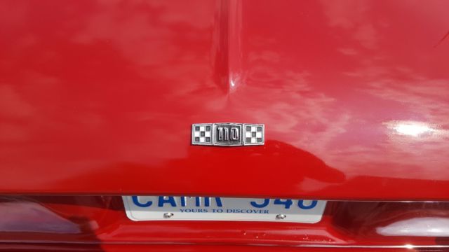 Red 1965 Chevrolet Corvair Sedan with White interior