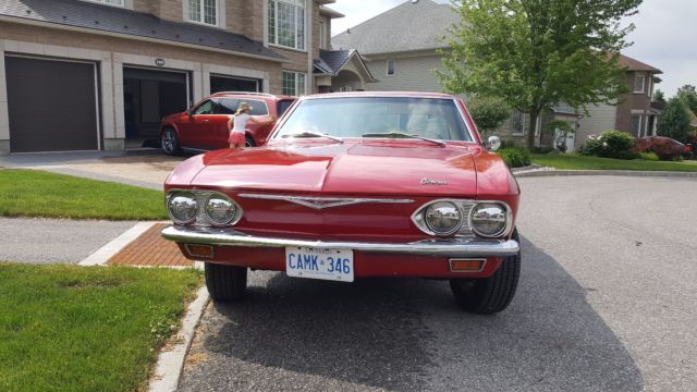 Red 1965 Chevrolet Corvair Sedan with White interior