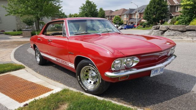 Red 1965 Chevrolet Corvair Sedan with White interior