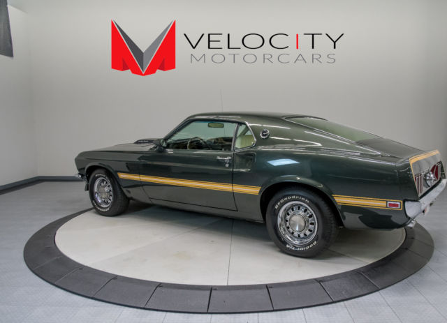 Green 1969 Ford Mustang Coupe with White interior