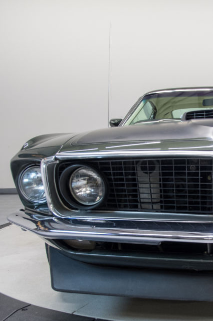 Green 1969 Ford Mustang Coupe with White interior