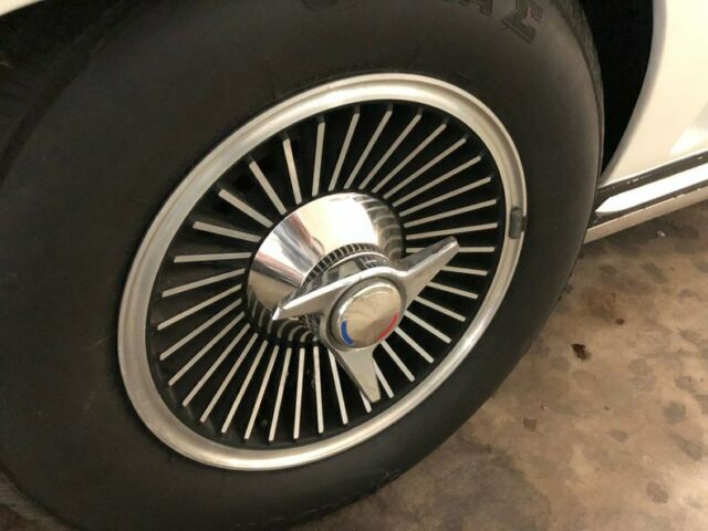 White 1965 Chevrolet Corvette Convertible with Red interior