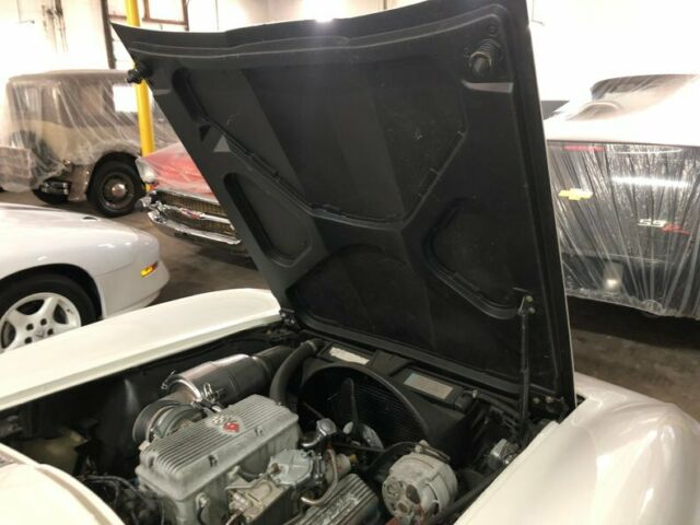 White 1965 Chevrolet Corvette Convertible with Red interior