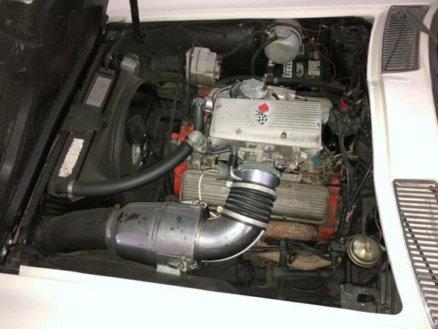 White 1965 Chevrolet Corvette Convertible with Red interior