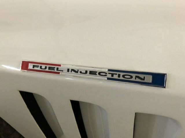 White 1965 Chevrolet Corvette Convertible with Red interior