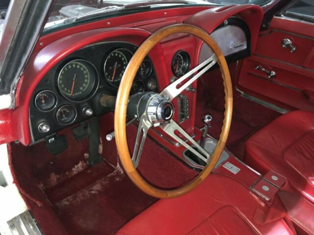White 1965 Chevrolet Corvette Convertible with Red interior