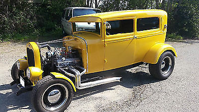 Yellow 1930 Ford Model A Sedan with Gray interior