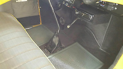 Yellow 1930 Ford Model A Sedan with Gray interior