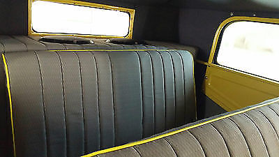 Yellow 1930 Ford Model A Sedan with Gray interior