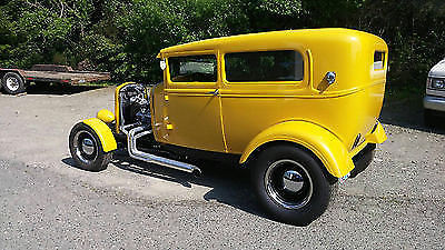 Yellow 1930 Ford Model A Sedan with Gray interior