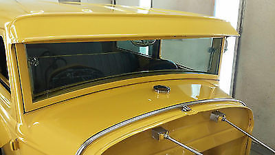 Yellow 1930 Ford Model A Sedan with Gray interior