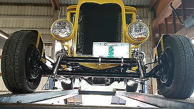 Yellow 1930 Ford Model A Sedan with Gray interior