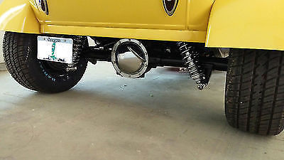 Yellow 1930 Ford Model A Sedan with Gray interior